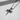 Close-up of textured oxidized silver nail cross pendant showing intricate binding details on a flat surface