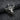 Angled view of handcrafted oxidized silver bull head pendant showcasing the fierce expression and metalwork detail.