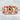 Heart Crown Ring, rose gold, front view on stone surface
