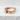 Scroll Heart Ring, rose gold, angled view on white textured surface