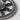 Macro view of the oxidized silver Hecate wheel pendant detailing the intricate strophalos labyrinth metalwork.