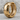 Cracked Hoop Earring, gold vermeil, product photo on rock surface