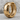 Cracked Hoop Earring, gold vermeil, product photo on rock surface