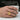 Gott Mit Uns Ring in gold vermeil, worn on model holding a cup