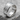 Ancient Artifact Ring, polished silver, angled view on stone base
