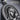 Close up macro shot of handcrafted oxidized silver Virgin Mary and child pendant showing fine hand finished relief