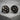 Forest Moon Wolf Cufflink, black rhodium, front view on stone surface