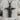 Open Arms Jesus Pendant, black rhodium, front view on stone display