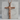 Halo Corpus Crucifix Pendant, rose gold, on grey stone pedestal