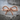 Rope Bow Knot Ring, rose gold, front view resting on stone