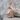 Sitting Cat Pendant, rose gold, angled view resting on stone