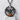 Baby Bat Pendant, black rhodium, front view on display pedestal