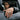 Lifestyle view of a man wearing a solid sterling silver cross ring on his finger while leaning out of a car window
