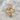 Climbing Leaf Ring, gold vermeil, front view on textured stone