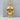Human Skull Pendant, gold vermeil, front view on display pedestal