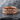 Cracked Earth Wedding Ring, rose gold, front view product photo on slate