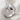 Anatomical Heart Ring in polished silver, front angled view on linen