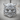 Horned Oni Mask Ring, polished silver, front view on wood surface