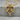 Twin dragon heart pendant, gold vermeil, product photo on stone background