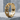 Baroque Ornament Ring, gold vermeil, angled view on stone base