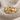 Swimming dolphin band ring in gold vermeil on textured fabric
