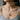 Woman wearing gold-plated seance circle necklace pendant on chain with gray top in casual lifestyle photo