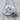 Trepanation Signet Ring, polished silver, product photo on wood surface