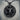 Bull Medallion Pendant, black rhodium plated, front view on stone pedestal