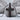 Cracked Latin Cross Pendant, black rhodium, front product view with chain against stone
