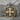 Acanthus Scroll Cross Pendant, two-tone finish, product view on stone surface