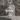 Praying Virgin Mary Cross Pendant, polished, front view on stone