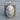 Native Chief Headdress Pendant, polished silver, front view on wood