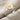 Star Set Signet Ring, two-tone finish, angled view on fabric