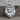 Mountain Bear Paw Pendant, polished silver, product photo on wood surface