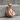 Snare Drum Pendant, rose plated silver, angled product photo on stone