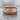 Acanthus flower band ring, rose gold vermeil, front view on stone surface