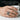 Acanthus Scroll Signet Ring, oxidized, worn on model hand holding a mug