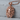 Coiled Serpent Medusa Pendant, rose gold, front view against stone backdrop