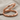 Two Loop Balance Ring, rose gold, angled view on fabric