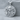 Skull Guns Pendant, polished, product photo on stone display