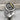 Elif Waw Relief Ring, two-tone finish, product view on stone surface