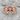 Ivory Ribbon Stacking Ring in rose gold plated silver, angled studio photo