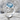 Blue Topaz Ribbon Loop Ring, polished silver, angled studio view