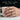 Quarried Ember Signet Ring, oxidized, worn on hand holding mug