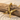 Bird Letter X Pendant, gold vermeil finish, angled on driftwood