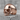 Jawless Skull Ring, rose gold, product photo on stone surface