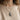 Model wearing handcrafted 925 sterling silver Maya duality pendant styled over a beige knitted sweater