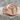 Hermetic Seal Ring, rose gold, front view on stone pedestal