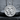 Double Venus Medallion Pendant, polished, front view on stone surface
