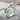Women Embracing Ring, polished silver, front product photo on stone